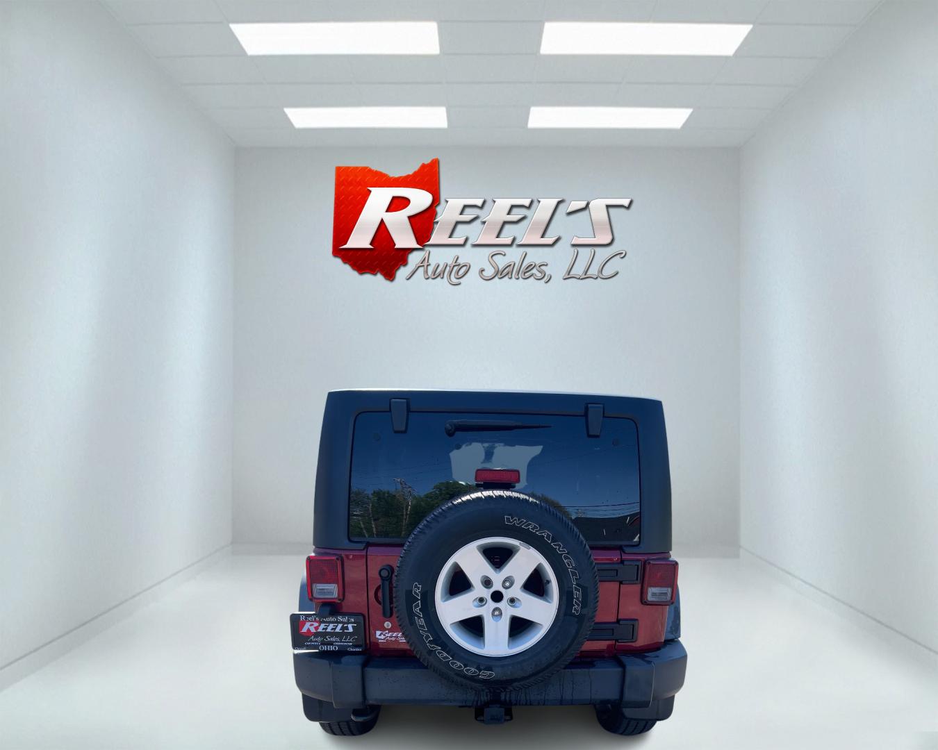 2012 Red /Black Jeep Wrangler Unlimited Sport 4WD (1C4BJWDG3CL) with an 3.6L V6 DOHC 24V engine, 5-Speed Automatic transmission, located at 547 E. Main St., Orwell, OH, 44076, (440) 437-5893, 41.535435, -80.847855 - This 2012 Jeep Wrangler Unlimited Sport with 4WD features a robust 3.6-liter Pentastar V6 engine paired with a 5-speed automatic transmission. It is equipped with a Dana 44 rear axle and a Dana 30 front axle, ensuring durable and reliable off-road capabilities. The model comes with a hardtop convert - Photo#6